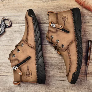 Men's rugged brown leather mid-top Martin boots with side zipper and hand-stitched detail