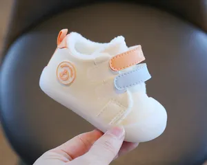 Detailed view of winter warm baby shoes with soft non-slip soles and fur lining.