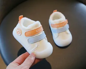 White winter baby toddler shoes featuring warm plush lining and dual-color velcro straps