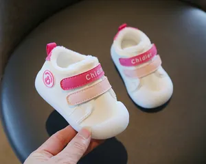 Detail view of warm winter baby walking shoes with soft fleece lining and velcro straps.