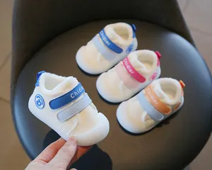 Detail showing winter plush toddler walking shoes with soft soles in multiple colors.