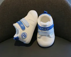 Macro detail of winter baby walking shoes featuring warm plush lining and blue hook-and-loop straps