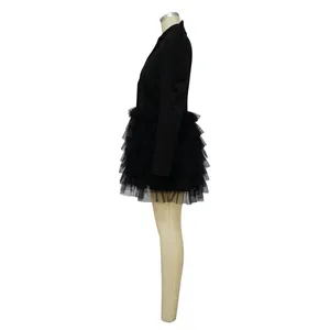 Detailed side profile of a black long-sleeve tiered tulle mini cake dress on mannequin