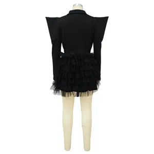 Detailed back view of a black tiered mini dress with exaggerated peaked shoulders