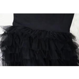 Macro view of the tiered black mesh ruffles on a stylish European style cake skirt detail