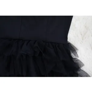 Detail shot showing the multi-layered black mesh tulle of this chic autumn cake dress