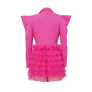 Back view of pink ruffled blazer dress with tiered tulle skirt and sharp shoulders