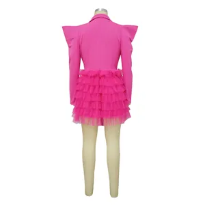 Back view of magenta blazer mini dress with tiered ruffled tulle skirt and pointed shoulders