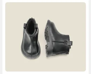 Detail view of black toddler Martens boots with warm fleece lining and side zipper