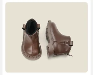Classic warm brown baby Martin boots with plush lining and anti-slip soles for winter wear.