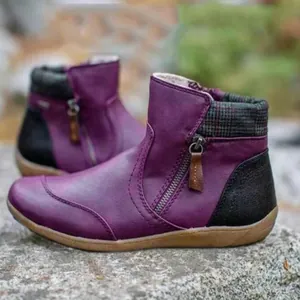 Detailed side view of purple leather ankle boots with side zipper and plaid collar design