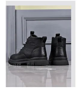 Detailed back view of men's black lace-up leather Martin boots with thick treaded soles