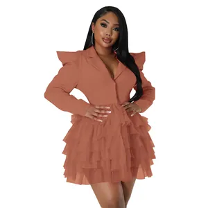 Chic burnt orange blazer dress featuring a tiered ruffle skirt and padded shoulders