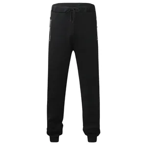 Front view detail of men's black sweatpants featuring drawstring waist and zipper pockets