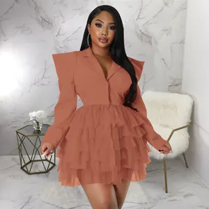 Terracotta blazer style tiered ruffle mini dress worn by a model in a luxury interior setting