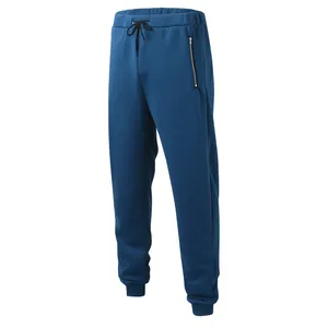 Front view of men's solid blue joggers with zipper pocket and drawstring waist