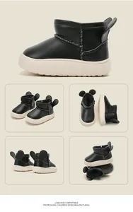 Detail views of black toddler snow boots with cute mouse ears and thick white soles.