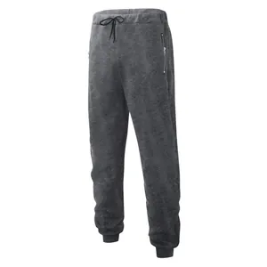 Front view of grey men's casual sweatpants with zipped pockets and drawstring waist