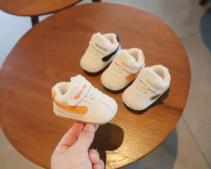 Close-up of baby winter walking shoes with warm fleece lining and Velcro strap