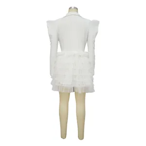 Detailed back view of white blazer dress with elegant layered mesh ruffled cake skirt