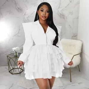 Elegant white tiered ruffle cake dress featuring structured shoulders and sharp blazer collar