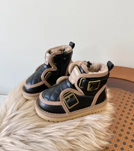 Stylish black children's snow boots with buckle details and warm faux fur lining
