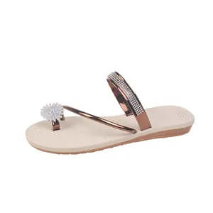 Elegant flat toe-ring sandals with rhinestone flower detail for summer fashion