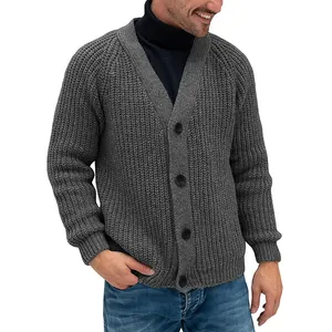 Close-up view of a grey men's chunky knit cardigan sweater featuring black buttons