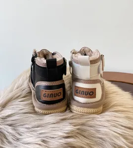 Close-up rear view of baby winter snow boots with warm plush lining and GINUO patches