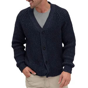 Detailed shot of men's navy blue chunky knit cardigan with button closure