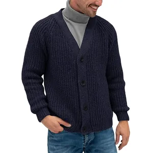 Detailed view of men's navy blue chunky knit cardigan with classic single-breasted buttons
