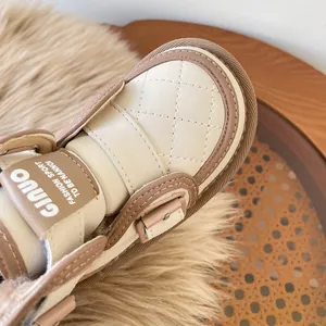 Warm cream and brown toddler snow boots with quilted detail and soft faux fur lining
