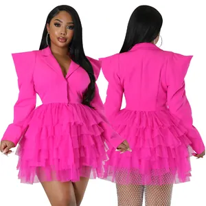 Detail view of hot pink blazer dress featuring structured shoulders and tulle skirt