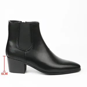Men's Chelsea boot detail showing the 6cm block heel and sleek black leather profile.
