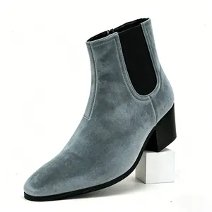 Close-up of grey suede men's high heel Chelsea boots with square toe design