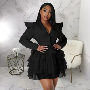 Detailed view of women's plus size black blazer dress with elegant tiered ruffle cake skirt