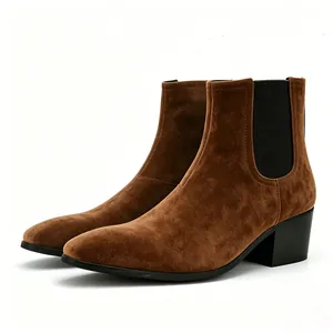 Detailed view of brown suede Chelsea boots with a block heel and square toe design.