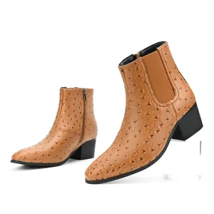 Detailed view of men's brown ostrich texture Chelsea boots featuring high block heels.