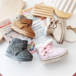 Cozy winter snow boots for toddlers in four colors featuring bow and velcro straps