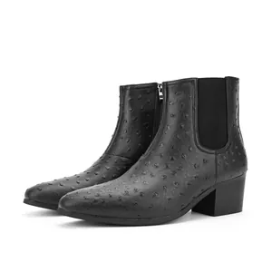 Detailed side view of black men's Chelsea boots featuring ostrich pattern and a square toe