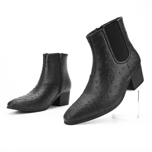 Detailed side view of men's black ostrich texture Chelsea boots with chunky heels.