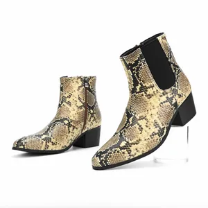 Detail view of men's snakeskin print Chelsea boots with square toe and high block heel