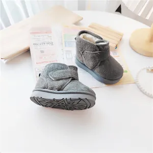 Grey winter snow boots for kids featuring warm fleece lining and star patterned anti-slip sole