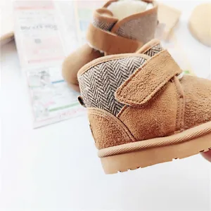 Detail view of warm toddler snow boots with faux fur lining and Velcro strap