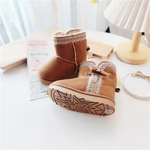 Cozy brown toddler snow boots with warm fur lining and star pattern sole