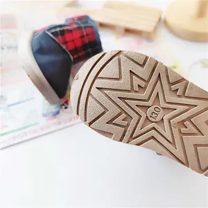 Close-up of durable non-slip star pattern sole on warm winter children's snow boots