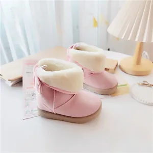 Soft pink children's snow boots with thick faux fur lining for winter warmth