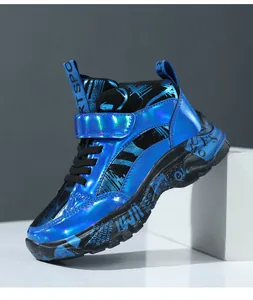 Detail of blue metallic children's winter boots with warm lining and thick soles.