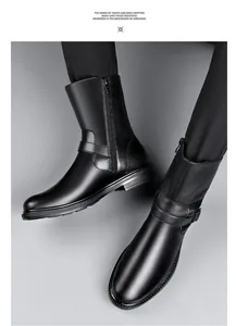 Close-up detail of black leather men's business boots featuring side zipper and buckle