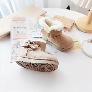 Detailed view of children's khaki winter snow boots featuring warm fleece lining and side bow.